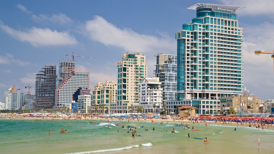 Tel Aviv featuring a coastal town, swimming and general coastal views