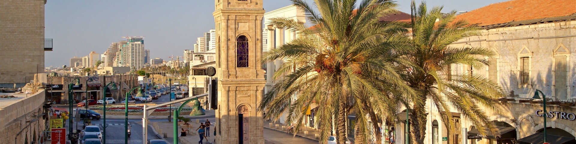 Torre do relógio de Jaffa mostrando um pôr do sol, arquitetura de patrimônio e uma cidade