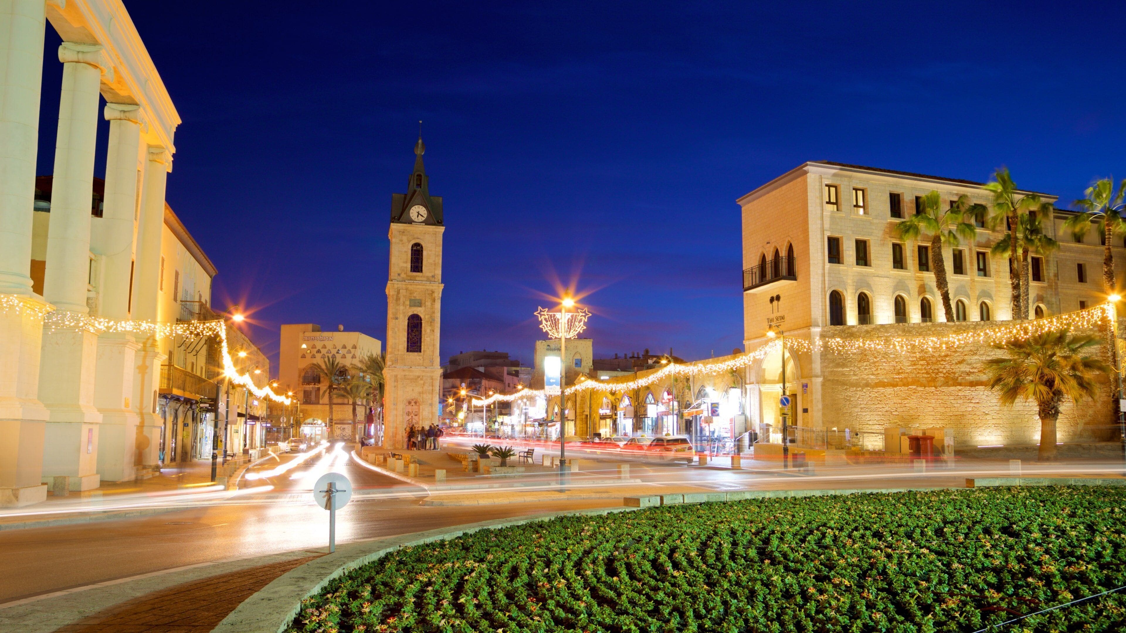 Jaffa Clock Tower showing a park, night scenes and heritage elements