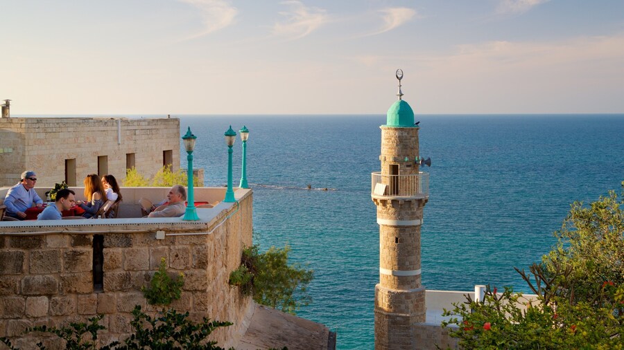 Sea Mosque showing a sunset, heritage elements and general coastal views