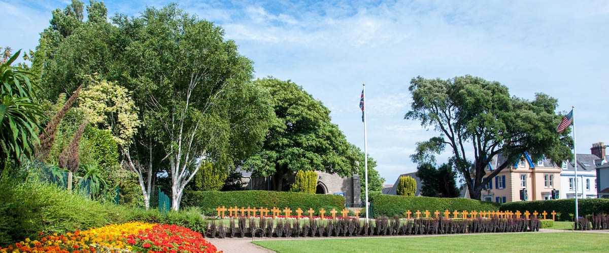 PGM57E The colourful allied forces cemetery in Howard Davis Park in St Helier on the island of Jersey. The image was taken on a warm summers day in July.
