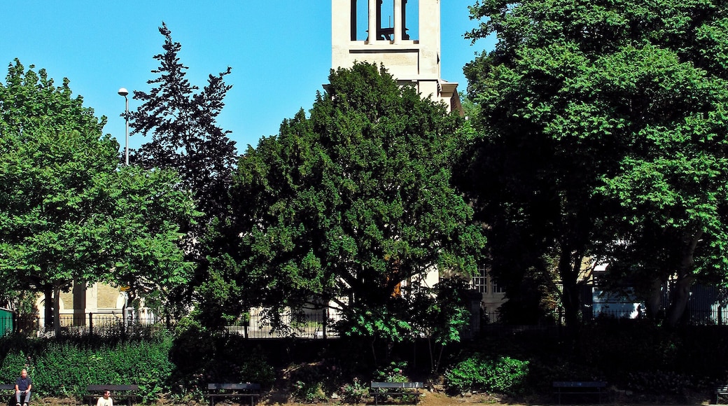 View east across the River Thames from Barge Walk, Kingston-upon-Thames to St Raphael's parish church, Surbiton