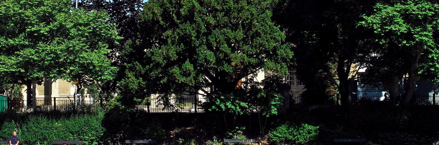 View east across the River Thames from Barge Walk, Kingston-upon-Thames to St Raphael's parish church, Surbiton