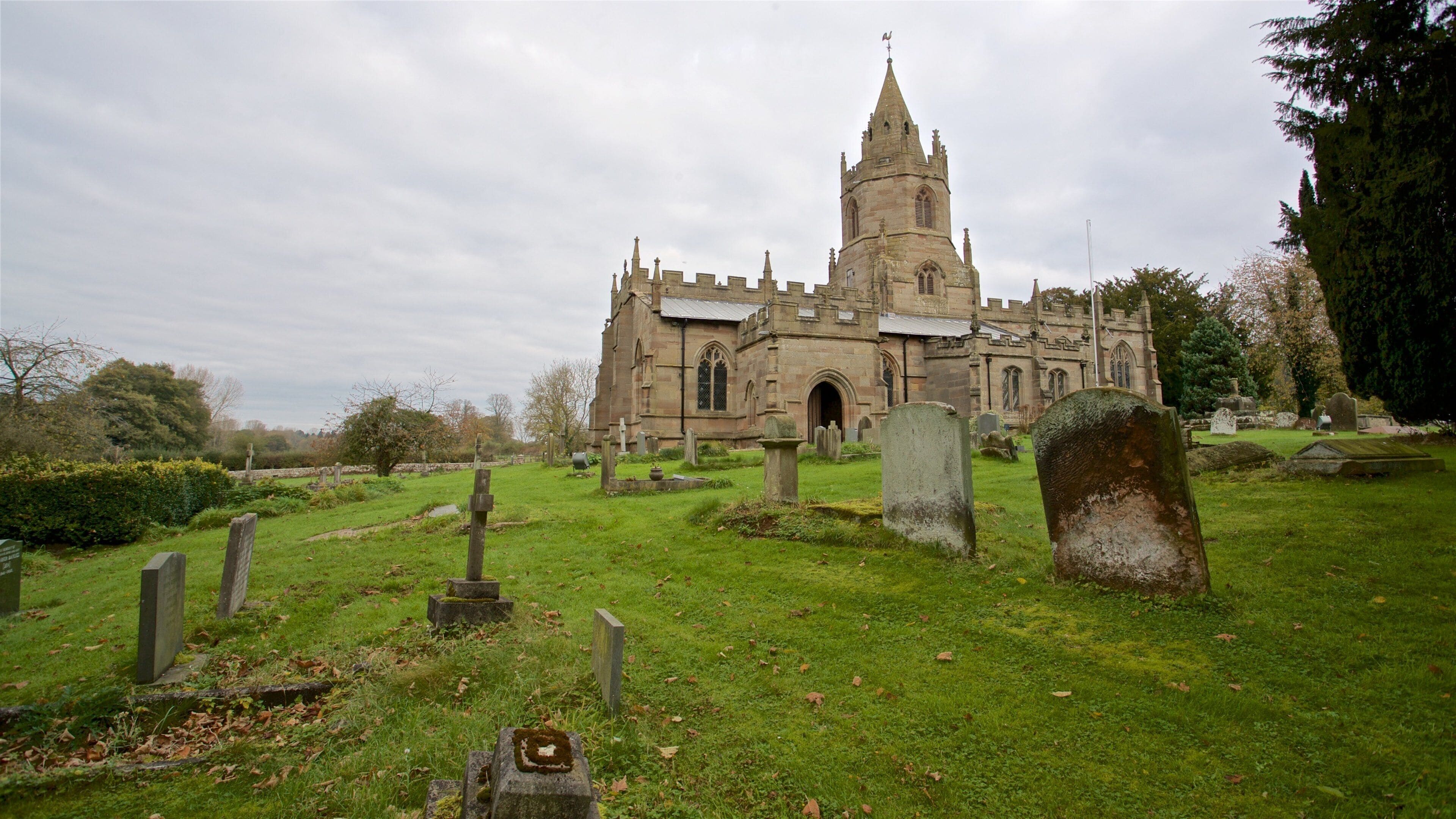 St. Bartholomews Church featuring heritage architecture, a church or cathedral and a cemetery
