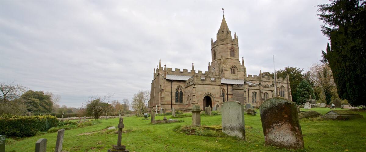 St. Bartholomews Church featuring heritage architecture, a church or cathedral and a cemetery