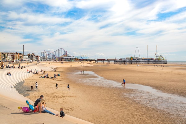 South Pier which includes a beach and general coastal views