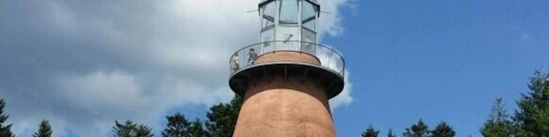 Lake with water sports, swimming and long walks. There is a bridge or ferry to take you over to a sculpture island, château and art museum. Great place to go with the dog.