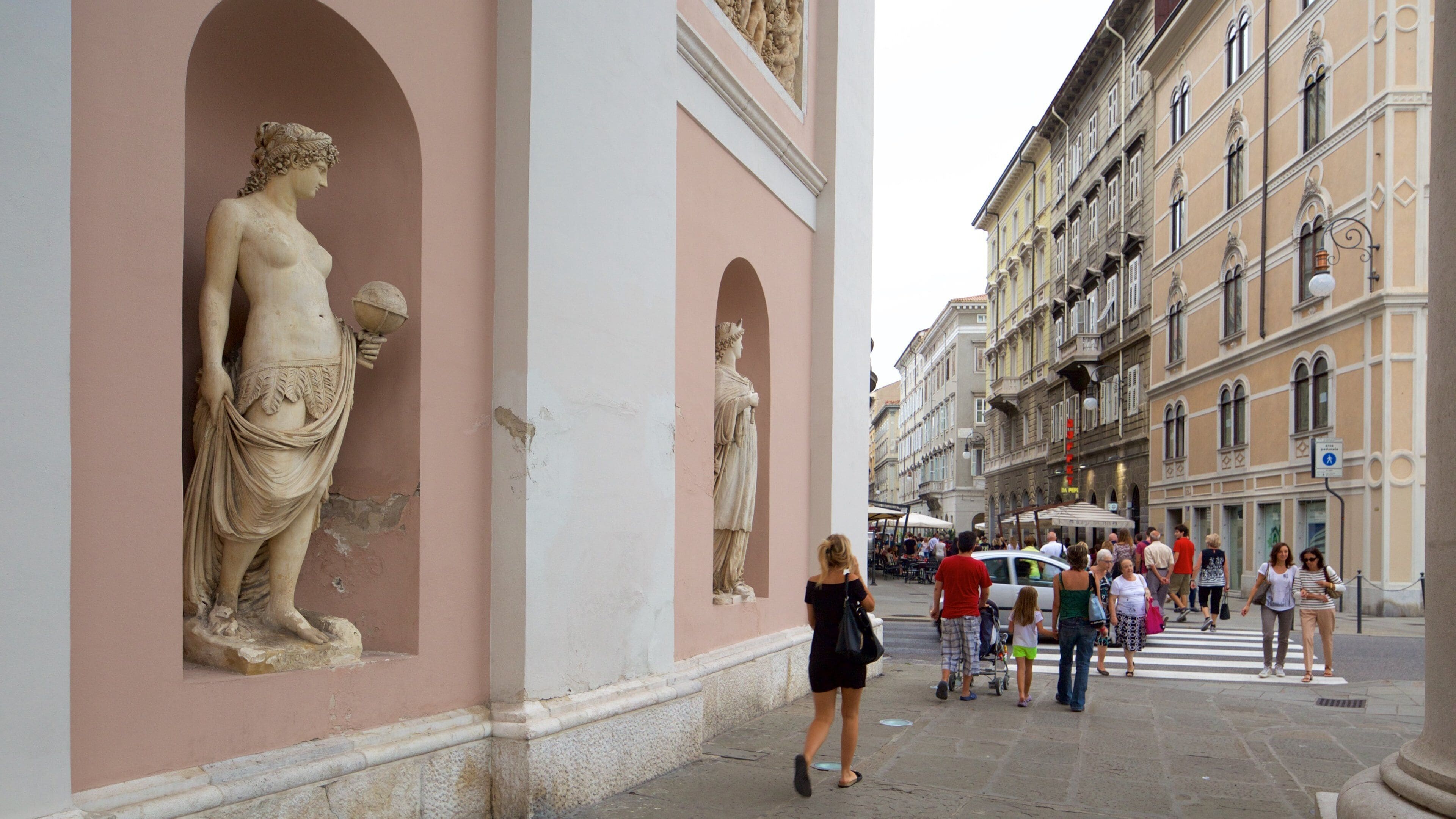 Trieste featuring heritage architecture as well as a large group of people