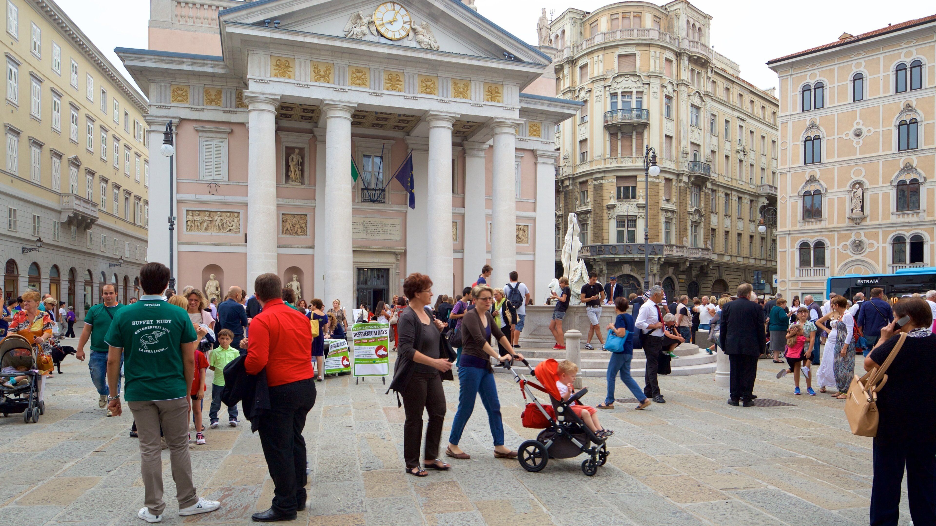 Borsa Vecchia showing heritage architecture and a square or plaza as well as a large group of people