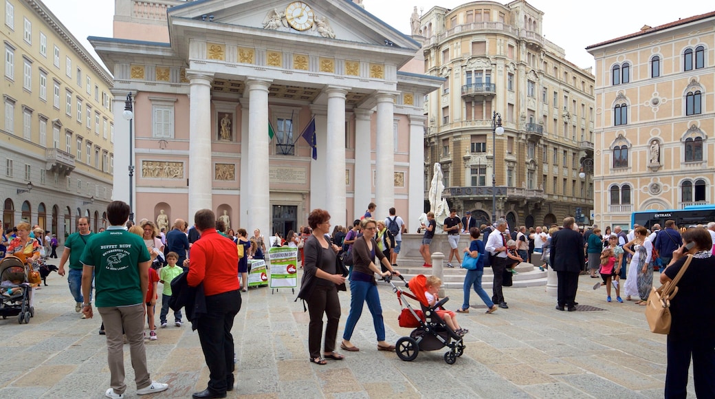 Borsa Vecchia showing heritage architecture and a square or plaza as well as a large group of people