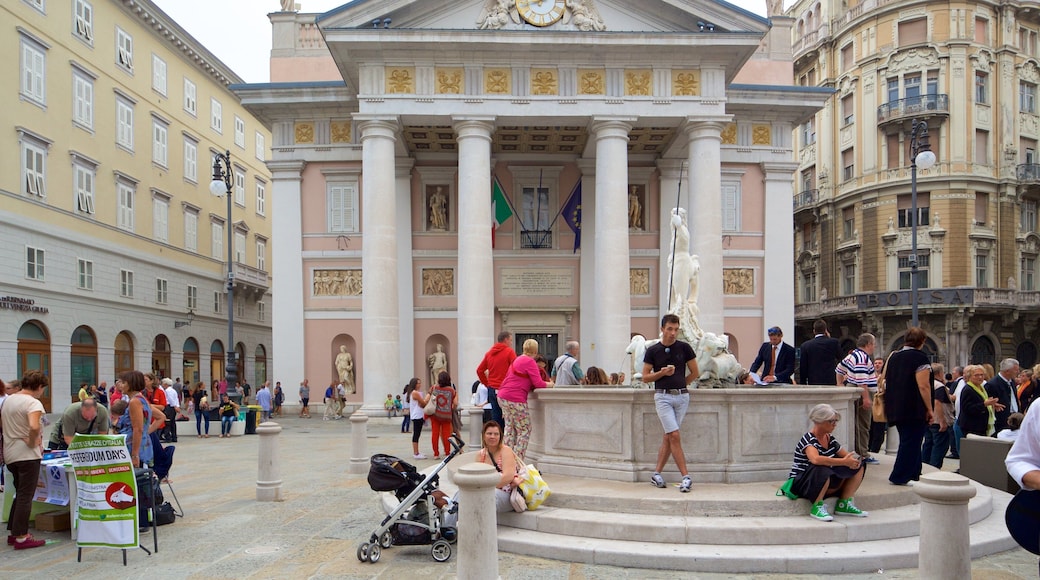 Trieste which includes heritage architecture and a square or plaza as well as a large group of people