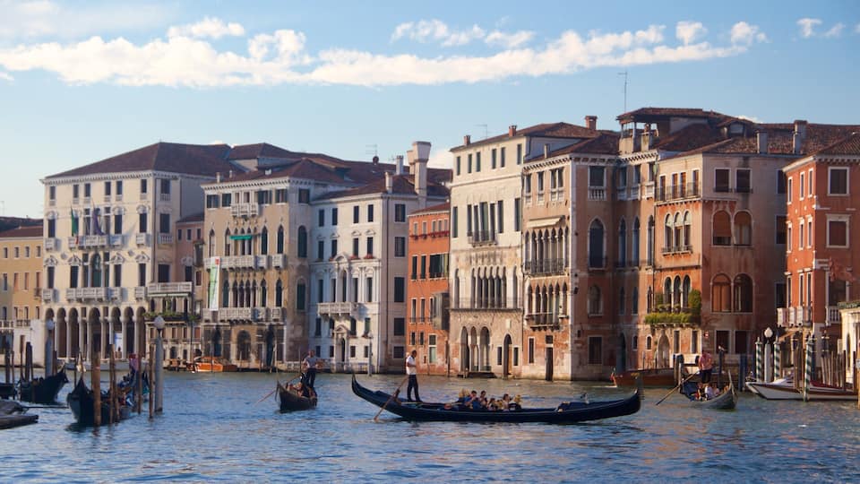 A canal in Venice with gondolas and historic buildings.