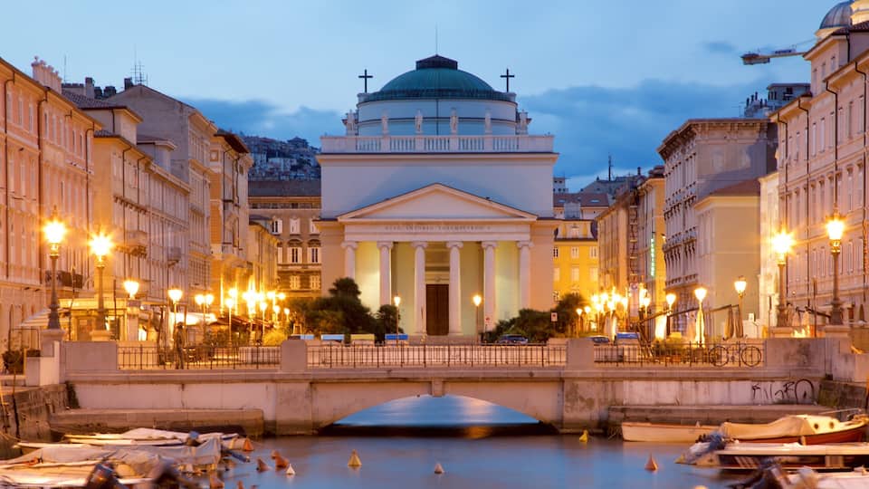 Canal Grande di Trieste showing a church or cathedral, heritage architecture and a city