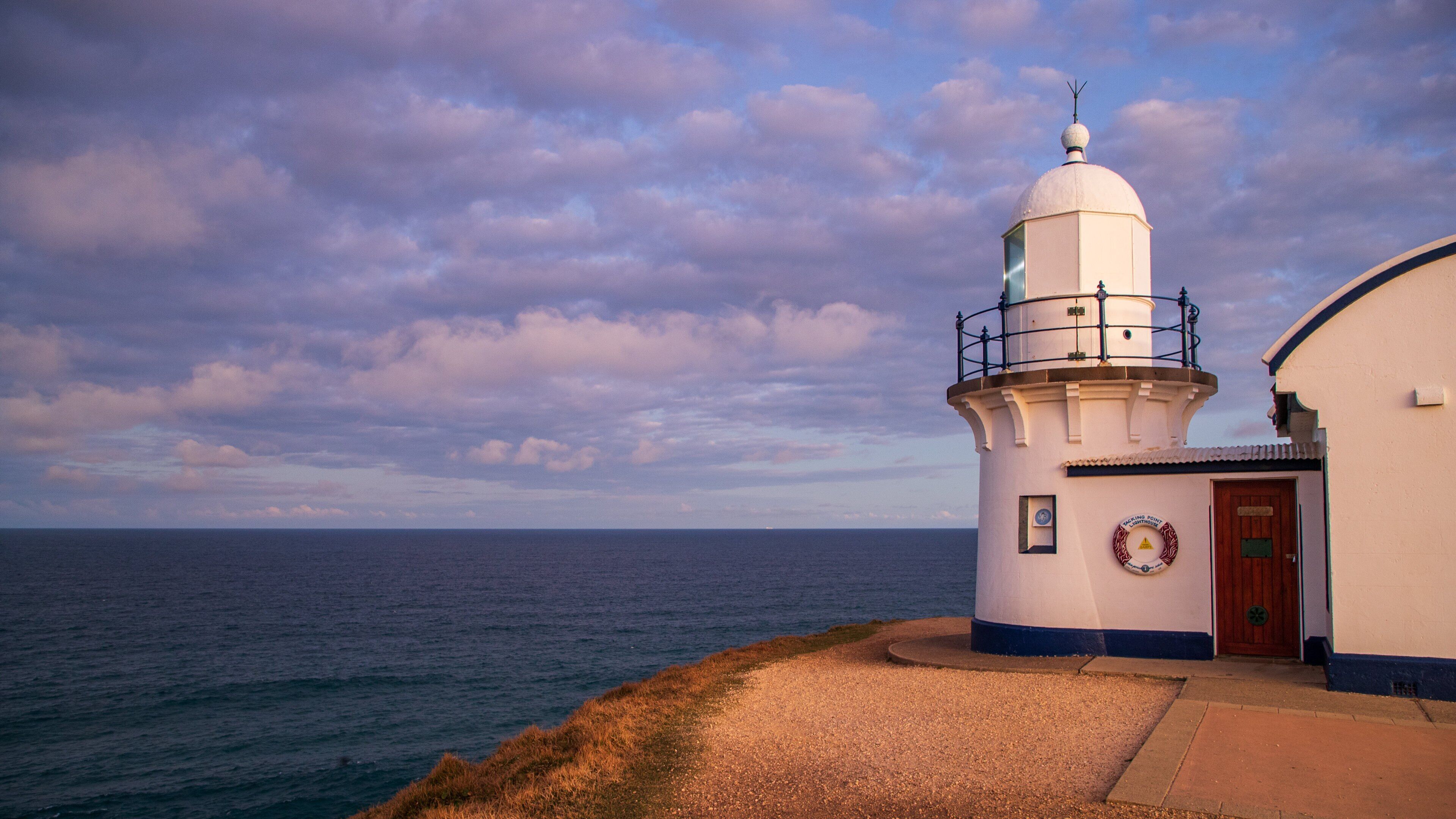 Tacking Point Lighthouse which includes a lighthouse and general coastal views
