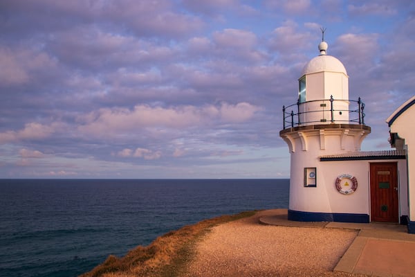 Tacking Point Lighthouse which includes a lighthouse and general coastal views