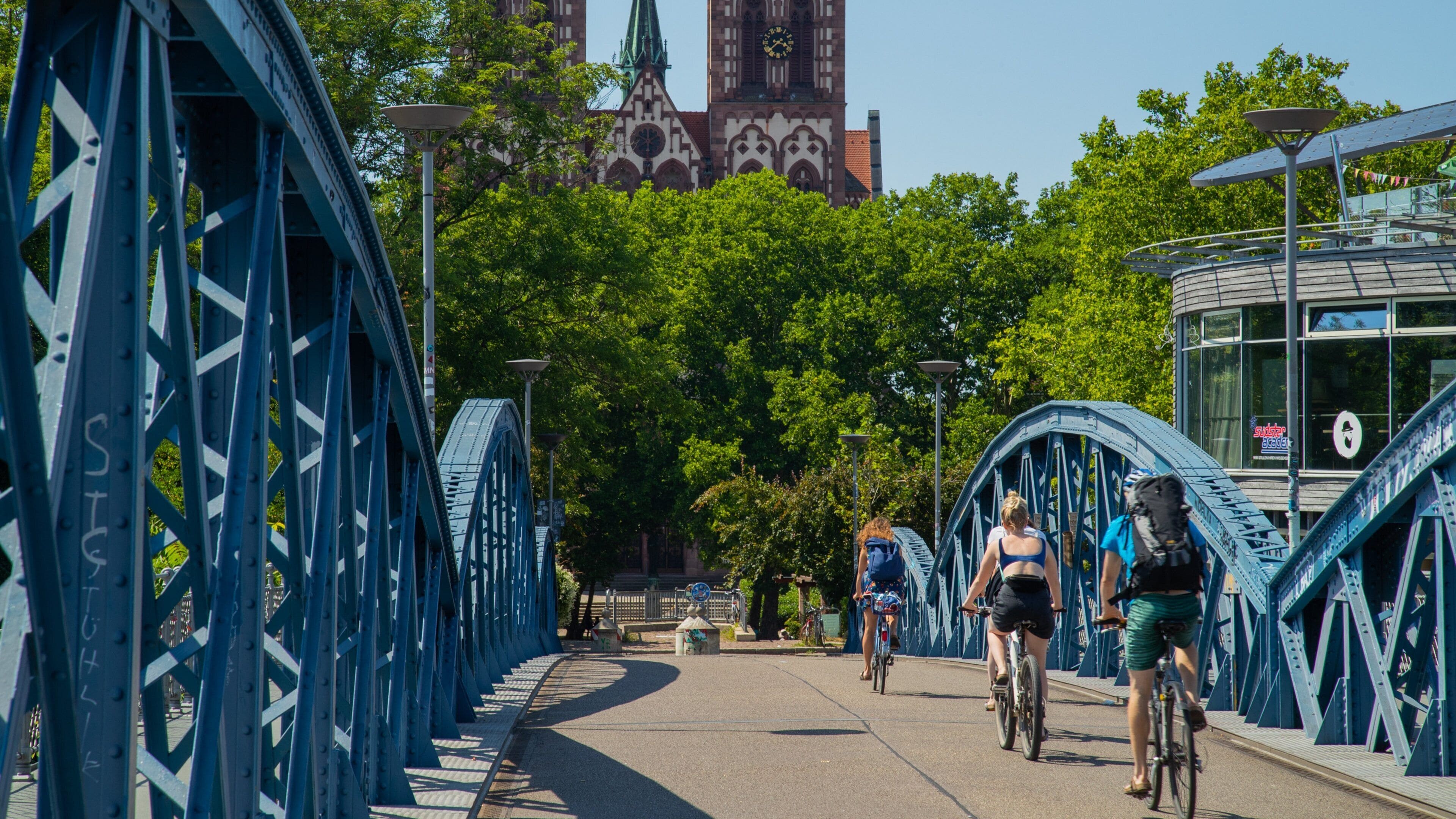 Blue Bridge showing cycling and a bridge as well as an individual male