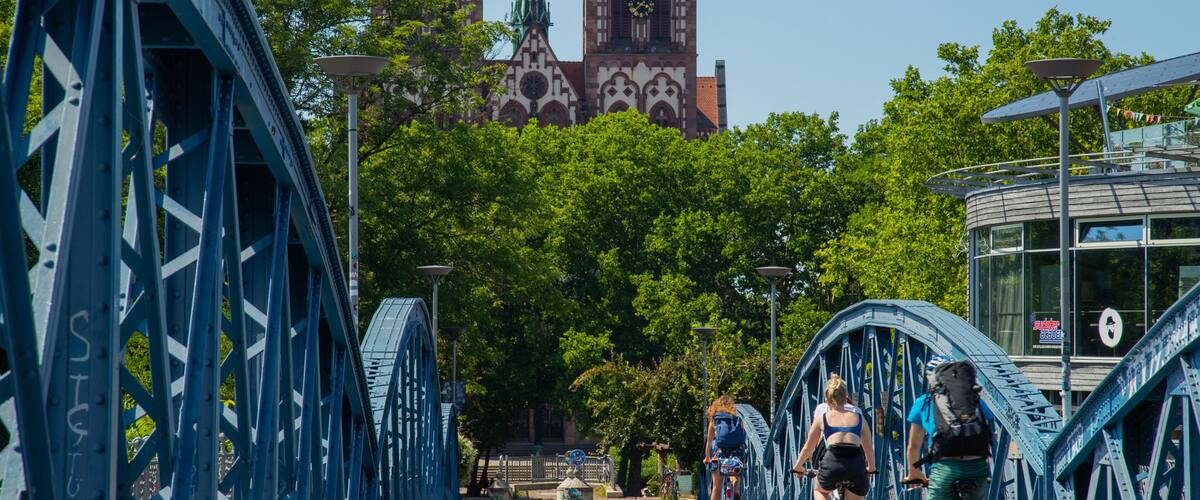 Blue Bridge showing cycling and a bridge as well as an individual male