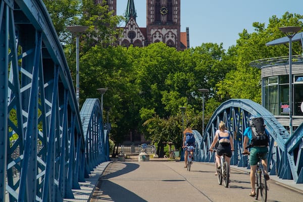 Blue Bridge showing cycling and a bridge as well as an individual male