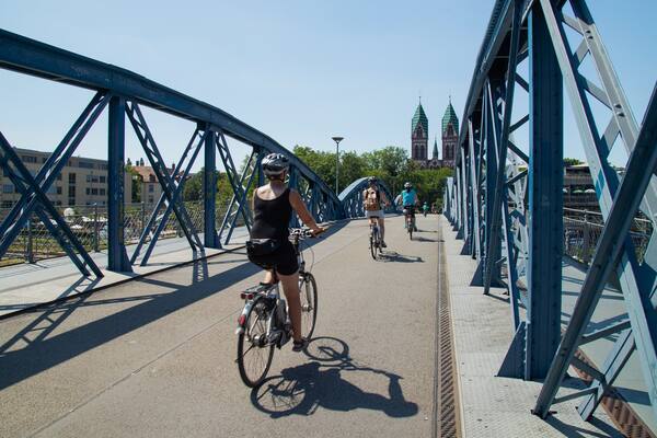 Blue Bridge featuring a bridge and cycling as well as an individual femail