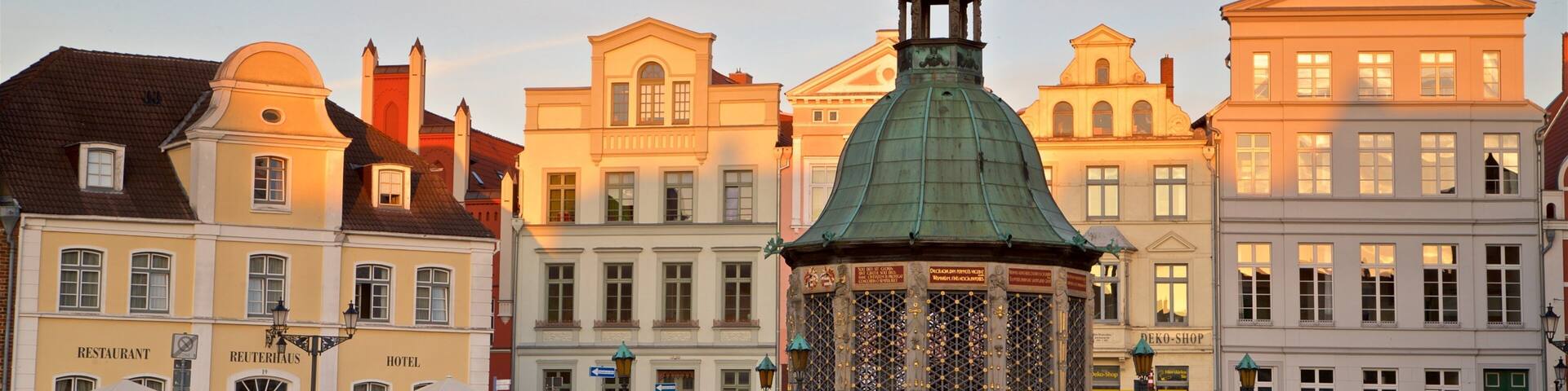 Wasserkunst featuring a sunset, a city and heritage elements