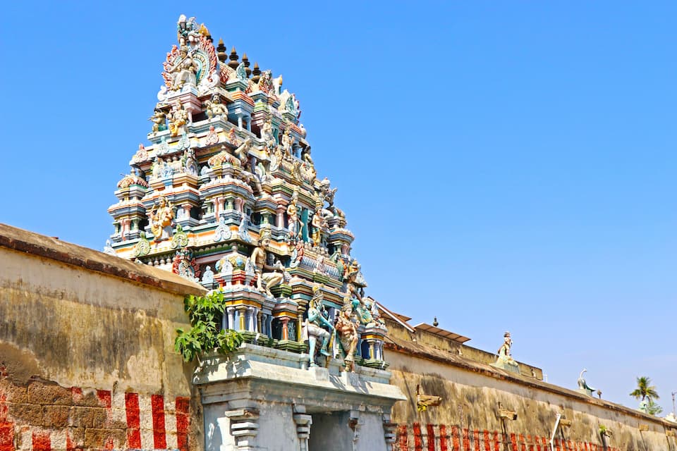 A colorful temple with intricate carvings and statues.