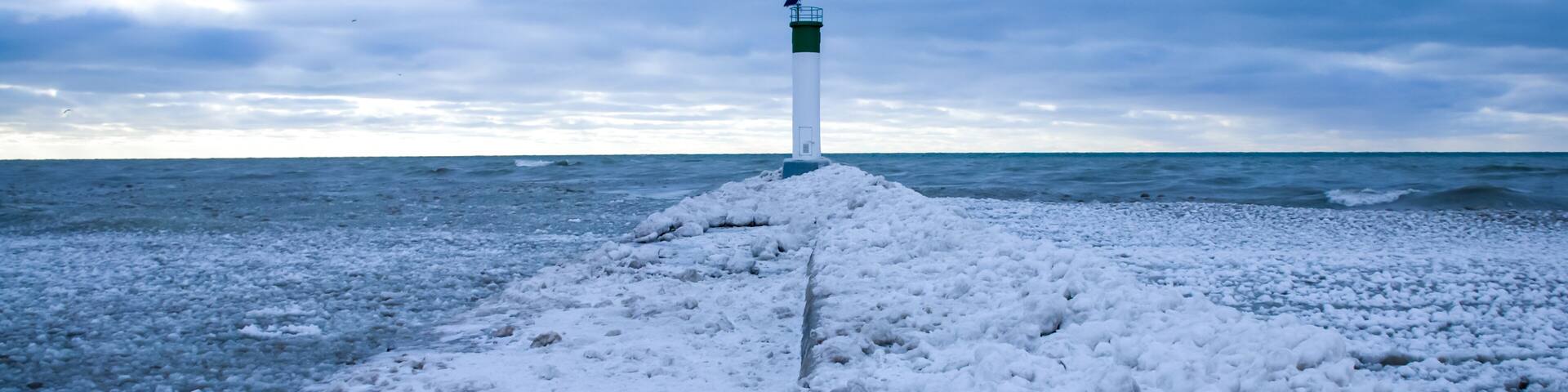 January 2021: A path of snow and ice leading up the pier to the Grand Bend Lighthouse at Grand Bend Beach.