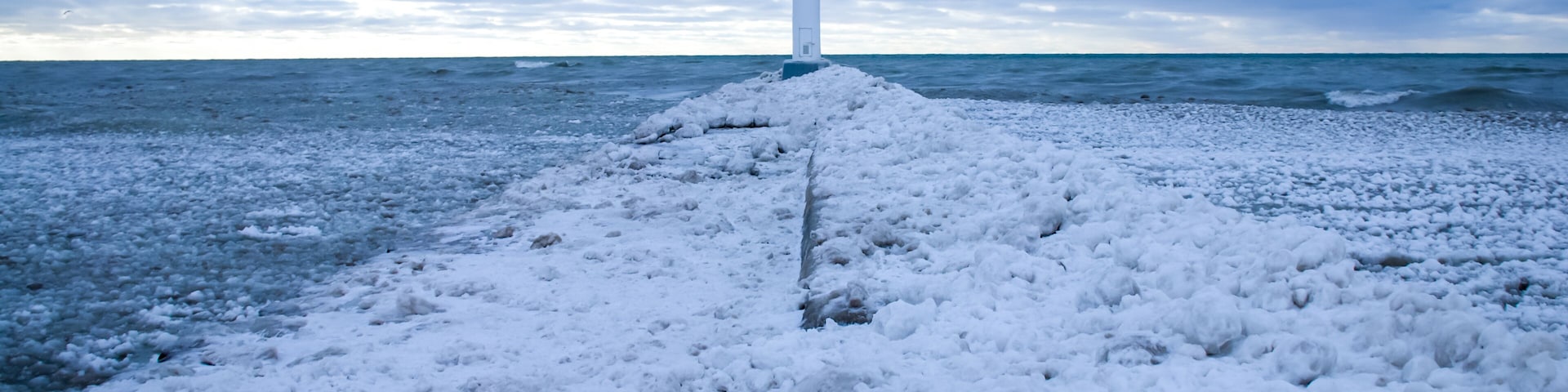 January 2021: A path of snow and ice leading up the pier to the Grand Bend Lighthouse at Grand Bend Beach.