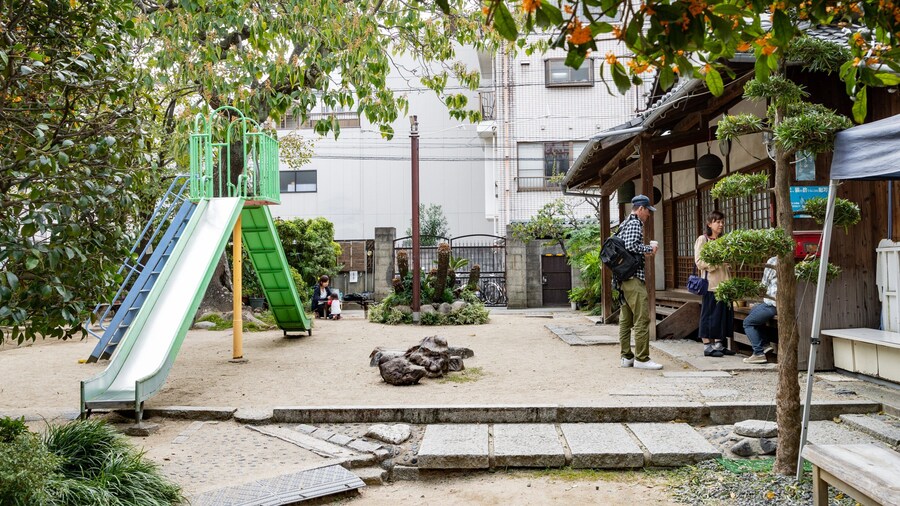 Enkoji Temple featuring a playground as well as a family