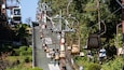A cable car system with passengers and empty seats.