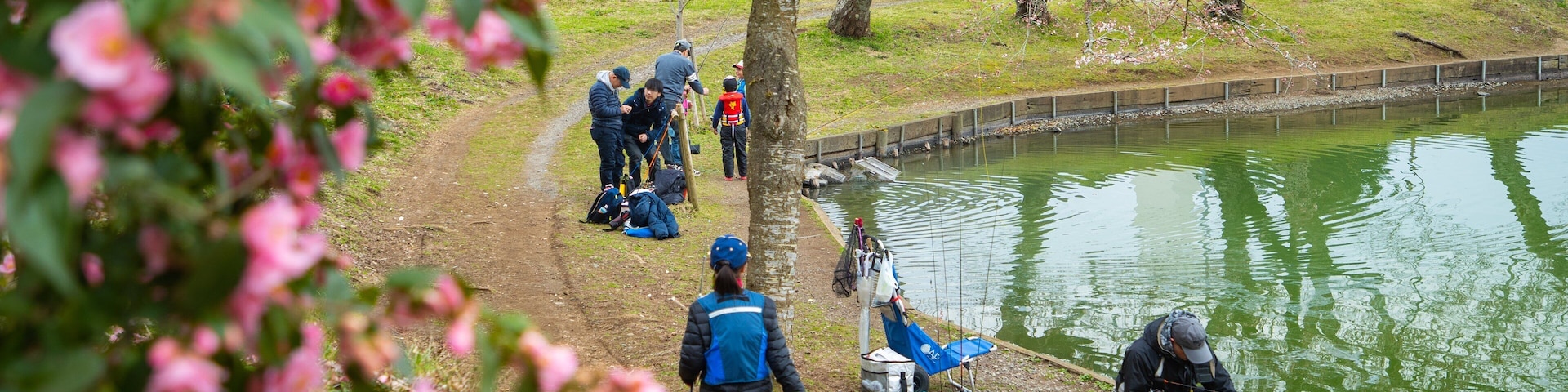 Lake Higashiyama showing a garden, fishing and a lake or waterhole