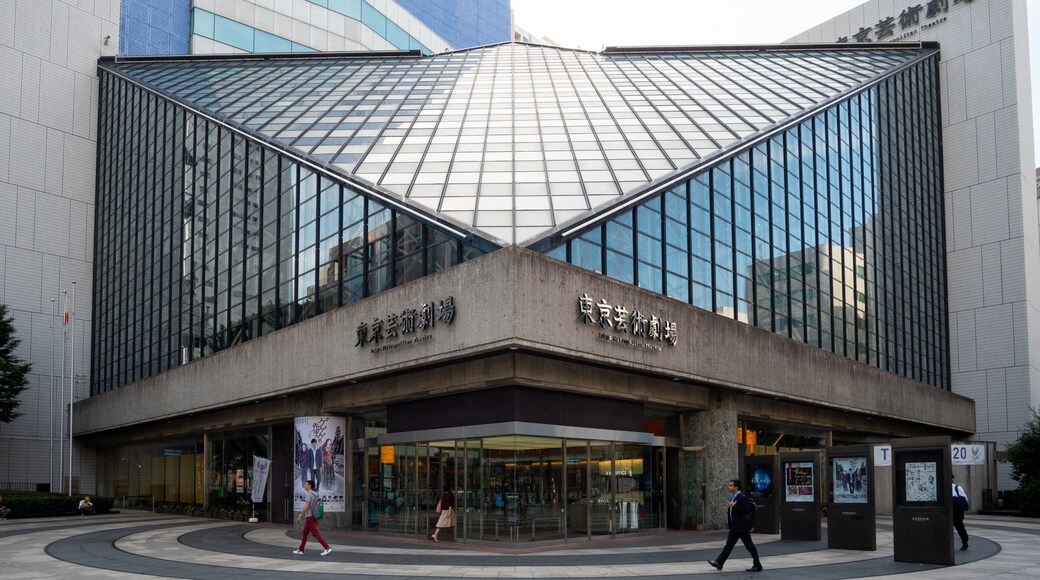 Tokyo Metropolitan Theatre featuring street scenes, modern architecture and signage