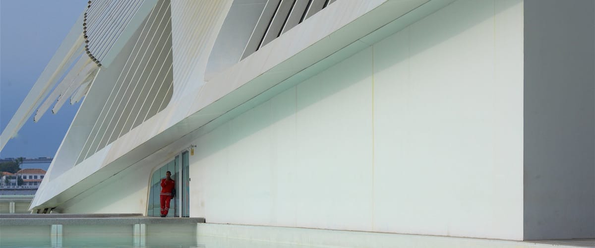 Museum of Tomorrow which includes modern architecture and a pond