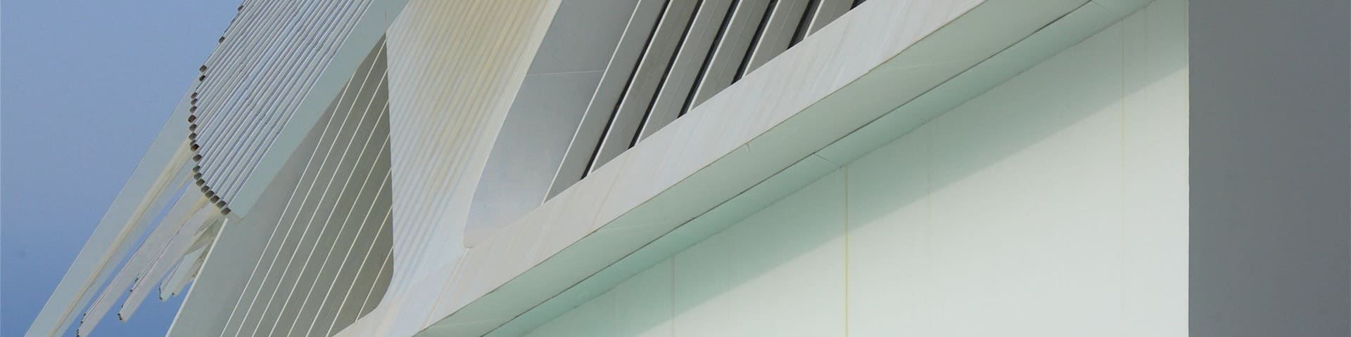 Museum of Tomorrow which includes modern architecture and a pond