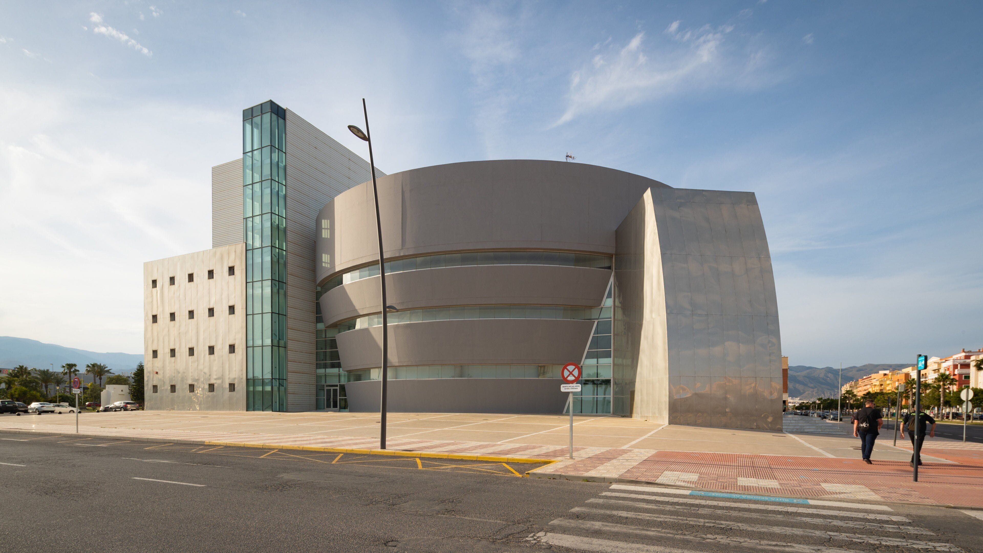 Teatro Auditorio Roquetas de Mar featuring modern architecture and a sunset