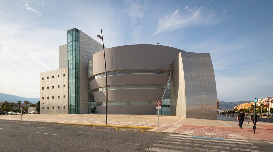 Teatro Auditorio Roquetas de Mar featuring modern architecture and a sunset