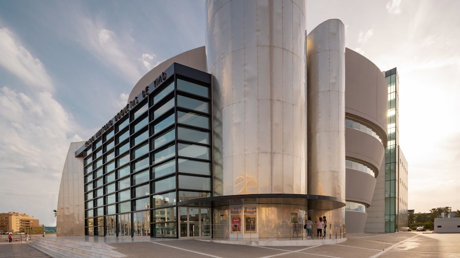 Teatro Auditorio Roquetas de Mar which includes modern architecture and a sunset