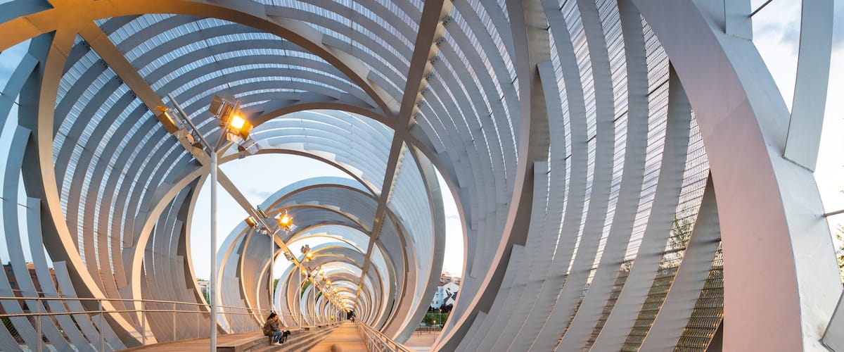 Puente Monumental Parque de Arganzuela showing a sunset and a bridge