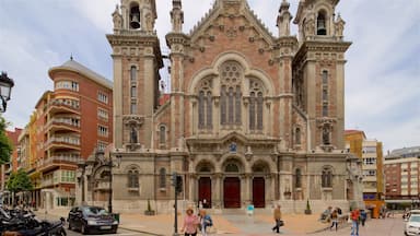 A historic cathedral with intricate architecture, including multiple towers and arched windows.