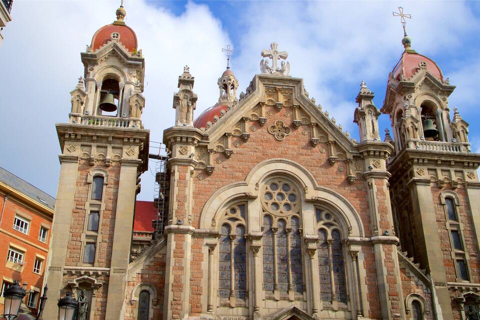 A historic church with ornate architecture, including multiple bell towers and a prominent dome.