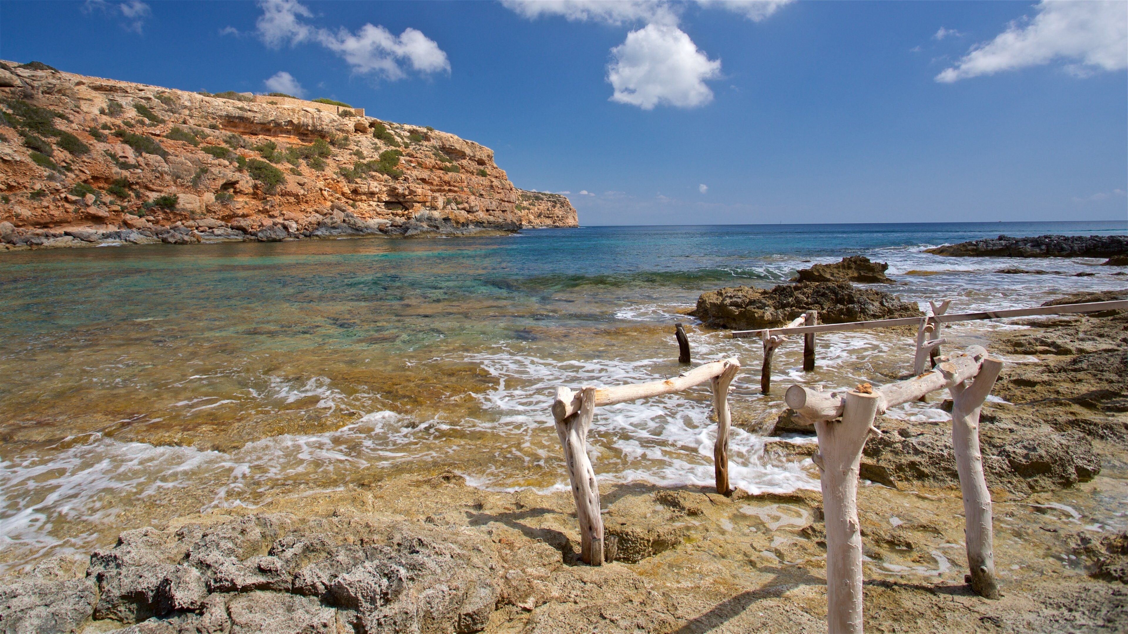 Cala en Baster featuring general coastal views and rugged coastline