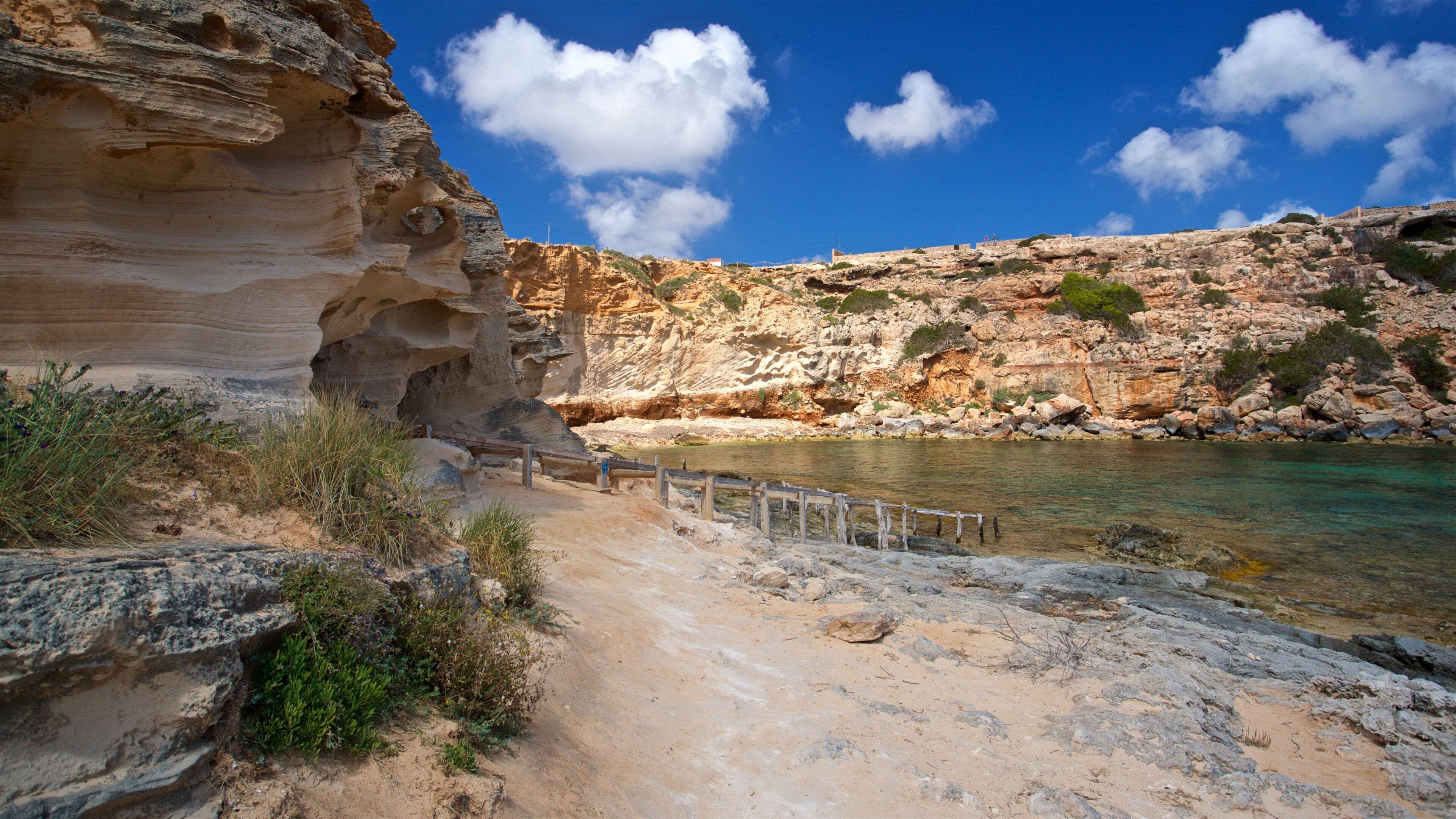 Cala en Baster featuring general coastal views and rugged coastline