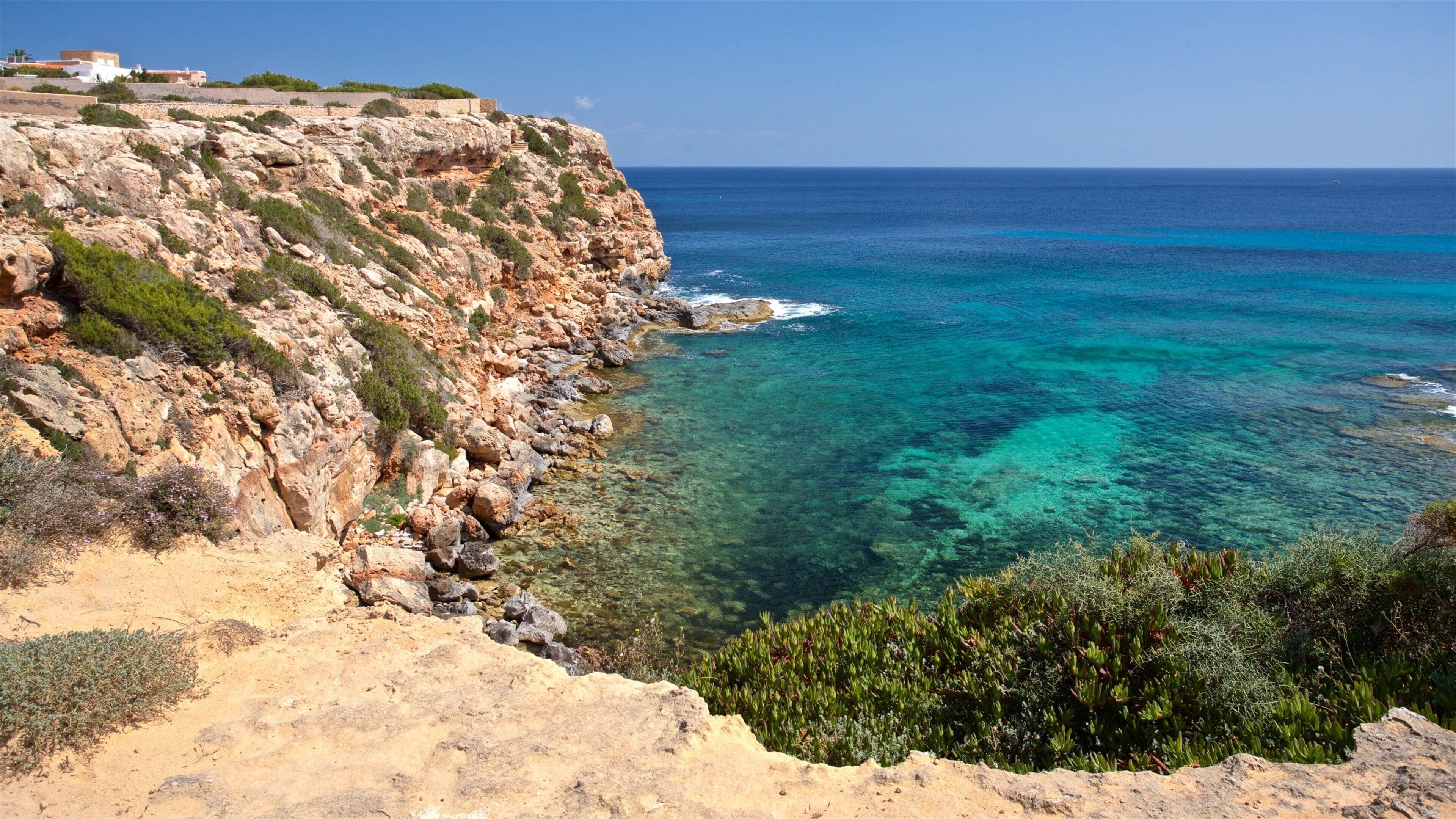 Cala en Baster featuring general coastal views and rocky coastline