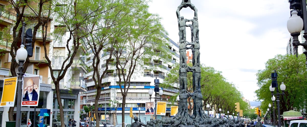 Monumento a los Castellers featuring a square or plaza, a monument and a statue or sculpture