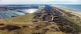 Panorama view of the dunes, beach, and the Westland greenhouses seen from above from the little village Ter Heijde aan Zee in the Netherlands.