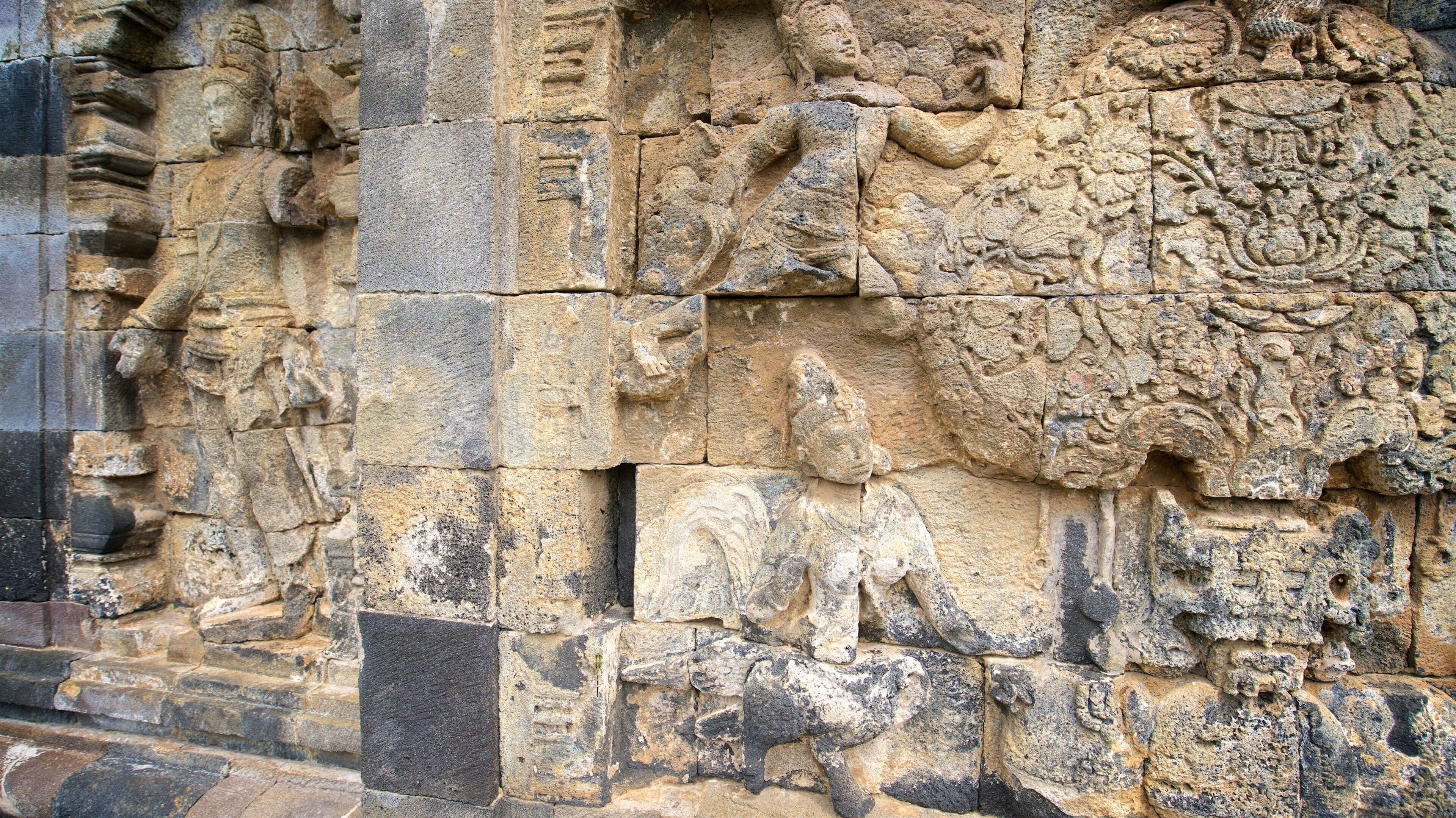 A detailed stone carving with intricate designs and figures.