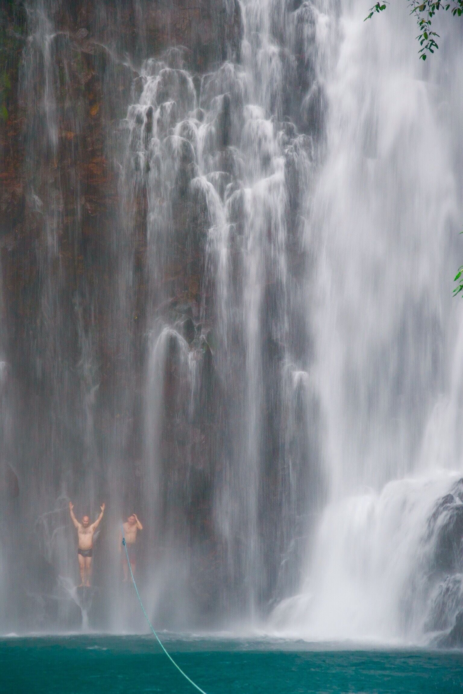 It's Tinago Falls this time! The word "tinago" means hidden. And yes, literally, it is hidden. It sits in the middle of the woods. Since I cannot incorporate in one picture all the beautiful parts of this falls, I posted separate photographs with the same caption.

There are two ways to get here. First is taking the 400-step stairs and the other is the 200-step stairs. No matter which way you choose, both are immensely EXHAUSTING! Whew! Just because it's only 200 steps does not mean it's easier than the former. It's a broken trail! The concrete stairs have been ruined by roots of old trees and plants, which make your journey even harder. Not to mention the cliff where you can fall off from if you don't watch out.

Let me talk about the mystery behind this (I'm thrilled as I begin): the truth is that no one has ever measured the depth of this yet. Many people attempted to do so, but they ended up losing their lives. Locals of this place say that there are "beings" that live underwater and that they take lives every now and then. No one knows whether that is true or not. It's a hearsay. All I know is that Tinago Falls remains a mystery to the world. Below the rock formations are caves. And just behind that water curtain lies another cave. And then a few more everywhere. A number of people has seen it, but it required them first an immeasurable amount of courage before they were able to do see the caves. The last time I came here, I got a chance to talk to a 23-year old guy who lives around. He claimed to be one of the caretakers of the falls. He recounted several stories he has witnessed over time, such as hearing cries all over the place very early in the morning, seeing a friend of his jump off from the top and died head-on; and looking at people risk their lives by trying to swim deep down (then they never came to the surface ever again).

The falls is overwhelming. Even I cannot stop staring at it despite having seen it already a thousand times in my life. I've heard that an aerial perspective of the lagoon/falls will you give you an image of just plain dark water. It may have appeared blue-green in the picture but from afar, it is black. Nonetheless, this place is best known for its relaxing atmosphere. The water is very cold -- so ideal for tropical countries like ours, especially during summer. People come here for picnics and picture-taking activities. I love this place. I can go on talking about it for hours. By the way, I've taken several friends here and they all said the same thing: "WOW!" I hope to also see this wow-expression on your face one day. You are most welcome in my city.

Happy travels,
Star, Iligan City, PH