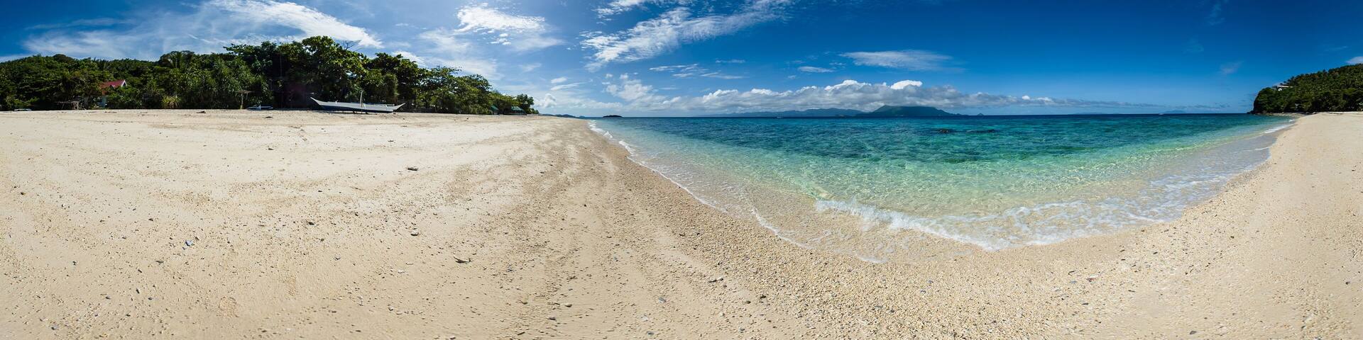 Crystal clear water crashing on sandy beach in Cobrador Island. Romblon, Philippines. VR 360.