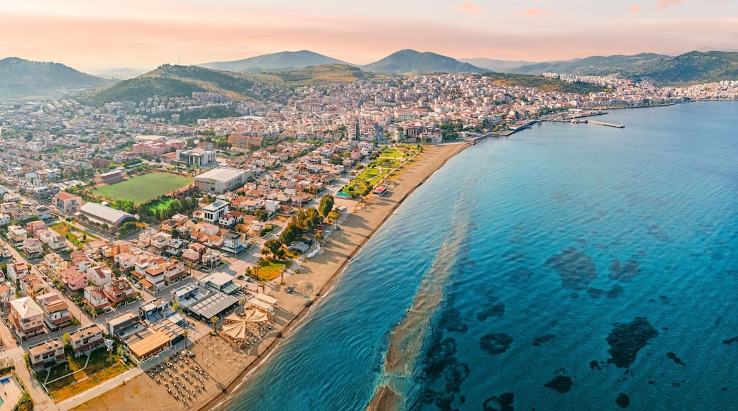 Stunning aerial view of Dikili coastline, bathed in the warm glow of sunset, showcasing the beautiful turquoise waters of the Aegean Sea