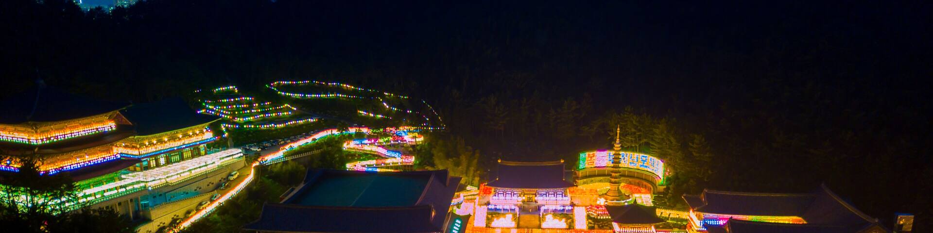 Aerial view of Samgwangsa temple at nighttime in Busan city, South Korea.Thousands of paper lanterns decorate Samgwangsa Temple in Busan city of South Korea for Buddha's Birthday.