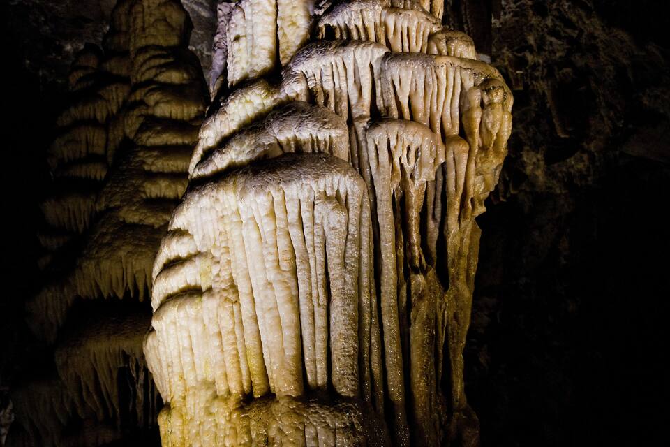 A close-up of stalactites in a cave.